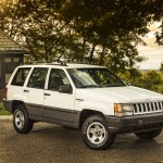 Although the development of the Grand Cherokee started under AMC’s watch, the Jeep brand was owned by Chrysler when it launched in 1993. Famously introduced to the world by crashing through the convention center glass at the 1992 North American International Auto Show in Detroit (the stunt would be repeated several weeks later in Jeep’s hometown of Toledo, Ohio), the Grand Cherokee set new standards for on-road ride, handling, and comfort in an SUV. The second-gen WJ was replaced by the all-new Grand Cherokee WK for the 2005 model year.