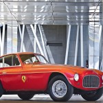 Color us surprised by this Ferrari 166MM Berlinetta’s sale price. Not that nearly $ 5.5 million is chump change, but it’s a good $ 500,000 less than the minimum sale price Gooding & Company had estimated for this Ferrari with a unique history—and a patina to match.--Starting life as an open-top barchetta, this 166MM was loaned to Giuseppe “Nuccio” Bertone of the Bertone design family, who raced the car in the 1950 Mille Miglia. There it finished 14th overall and third in class. By 1953, the 2.0-liter V-12 Ferrari gained a closed roof—becoming a berlinetta—designed and installed by Zagato. Sadly, the car eventually found itself at a Detroit used-car lot, where it was traded for a Triumph TR2 and some cash in 1957.